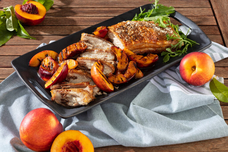 Crispy pork belly served with nectarine and wine sauce